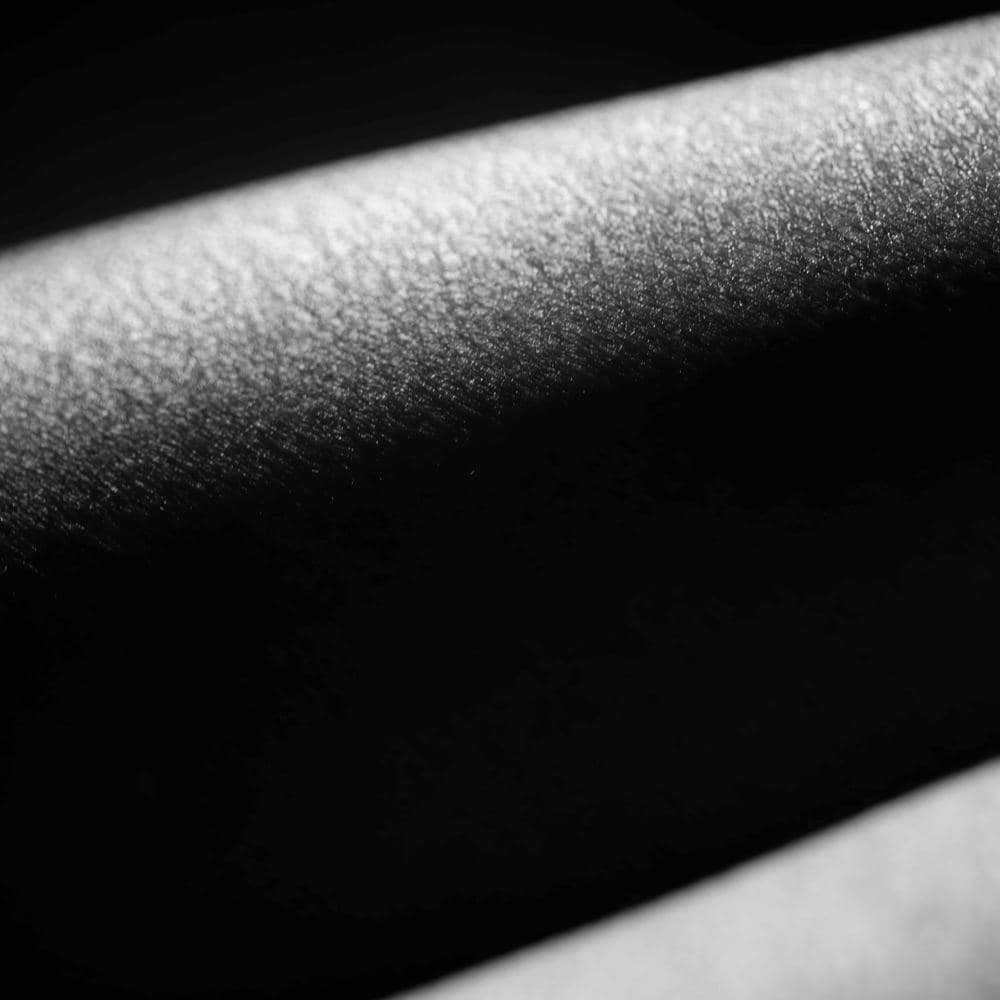 The Crease That Deepens When No One Is Watching — black and white photographic artwork by Nick Brand